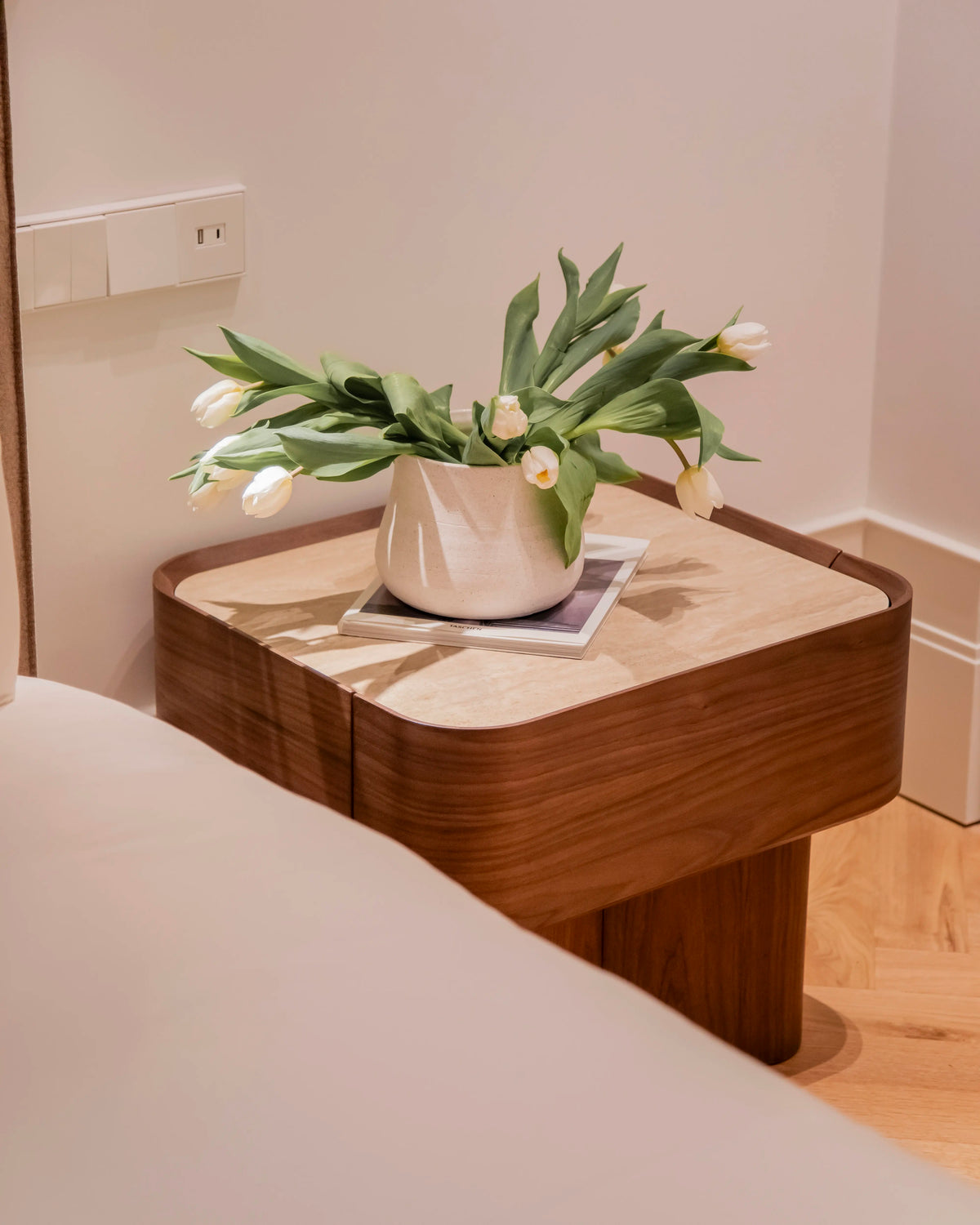 Avril side table in different wood finishes with a travertine marble top