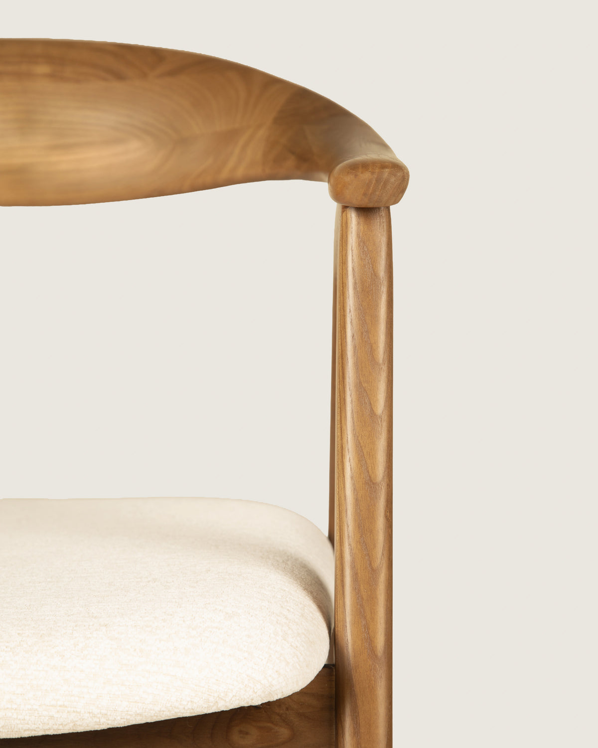 Lyra chair in different wood finishes with eos cream upholstery