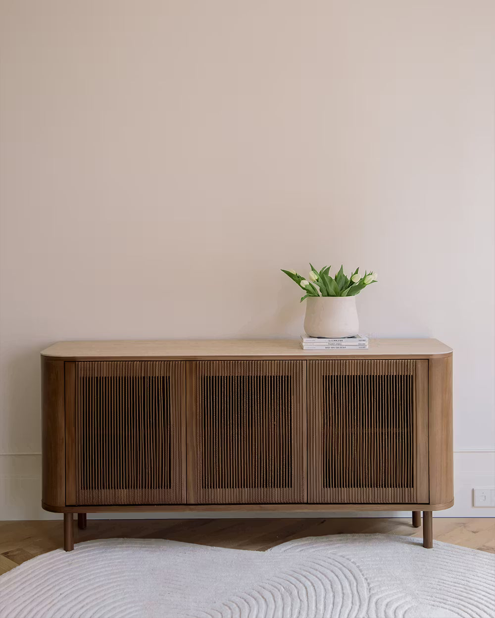 Ivy sideboard in different wood finishes with a travertine marble top