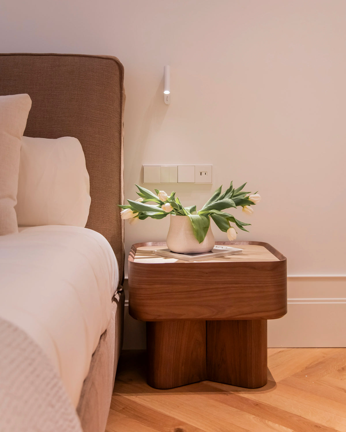 Avril side table in different wood finishes with a travertine marble top
