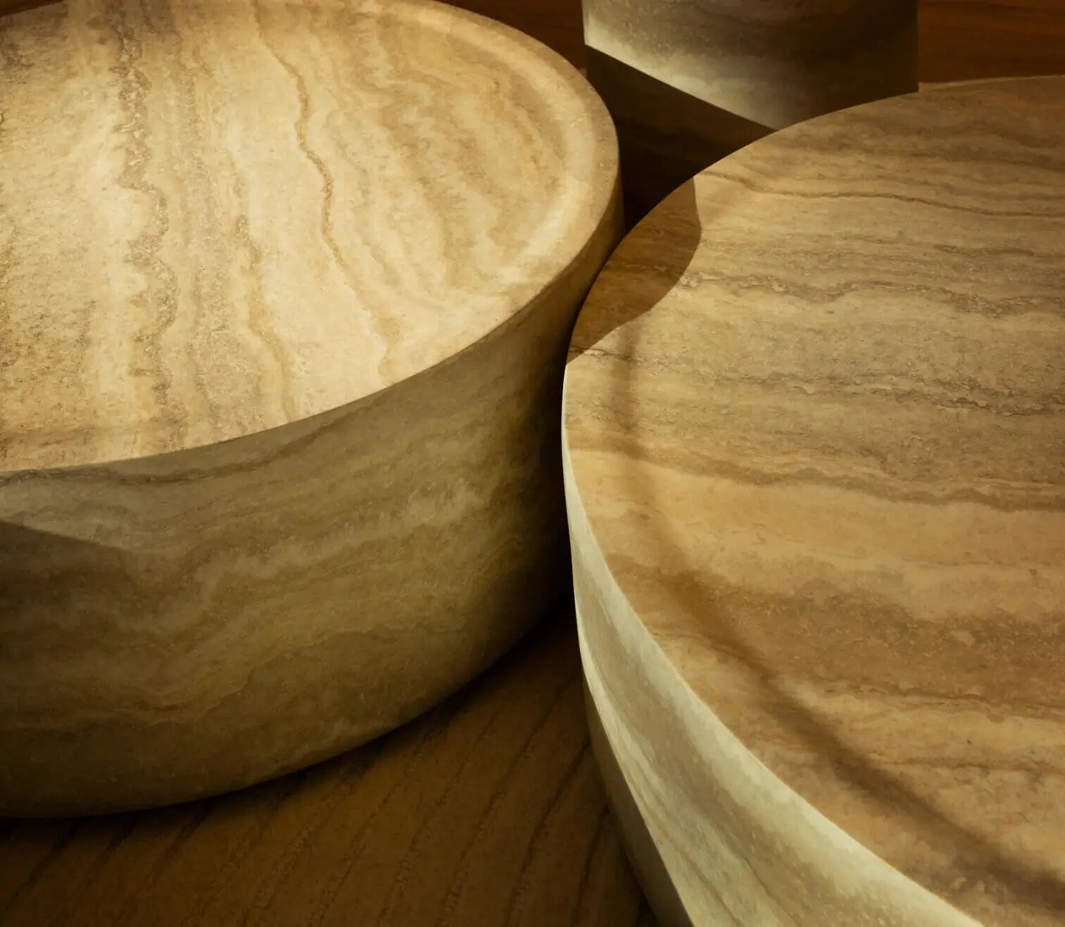 Tivoli round fiberglass coffee table with travertine marble finish