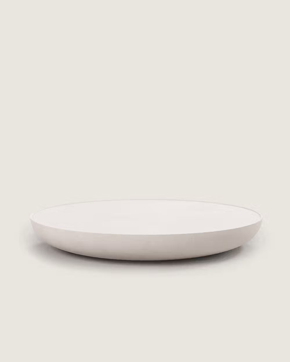 Mesa Rin de centro redonda de microcemento baja