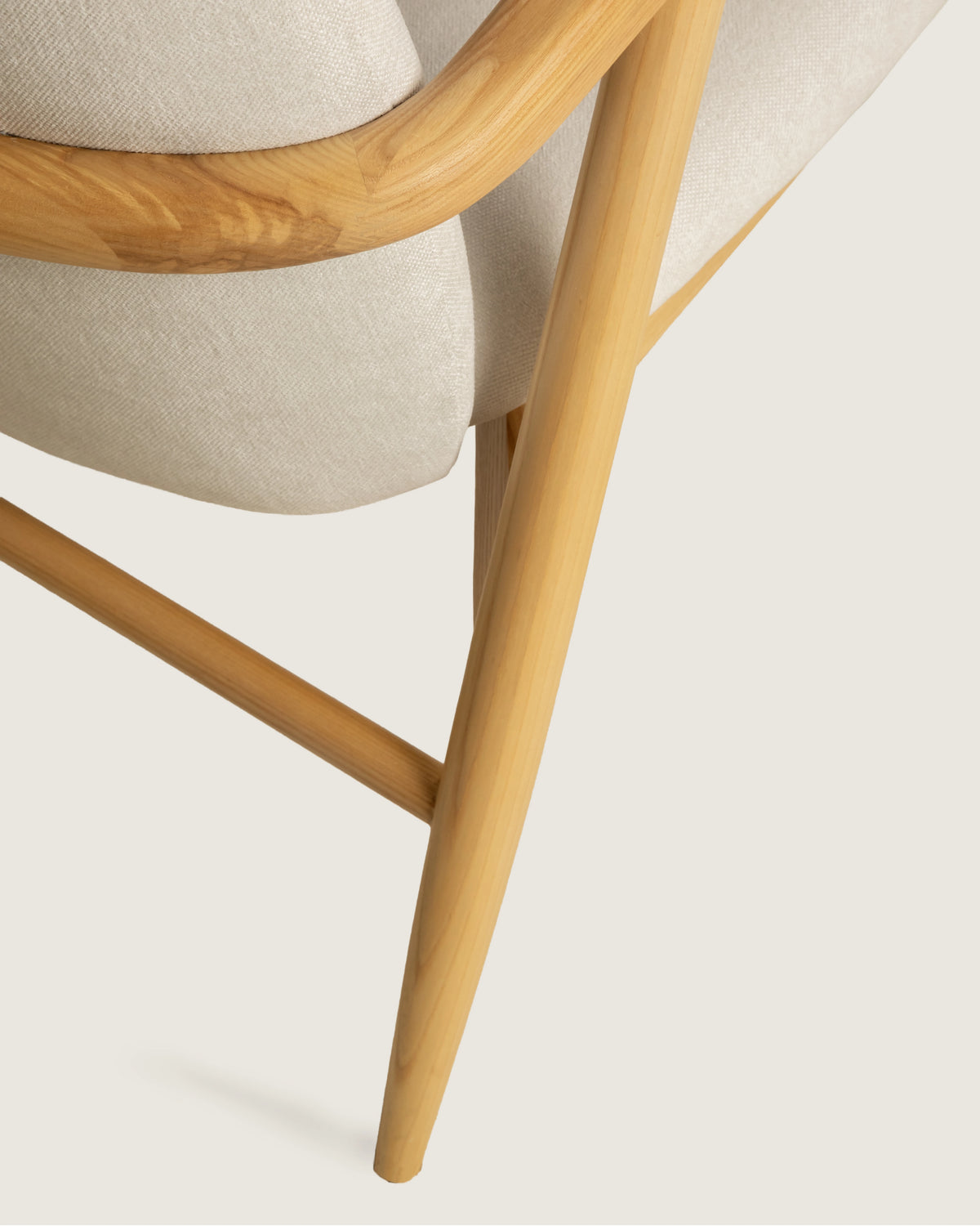 Lys armchair with wooden frame and vita creme upholstery