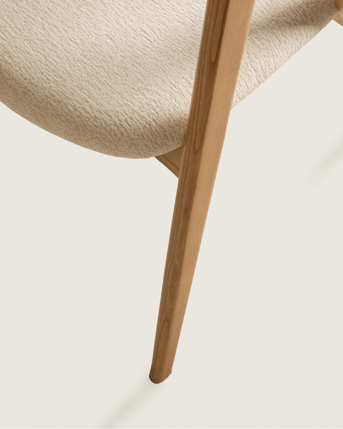 Lyra chair in different wood finishes with eos cream upholstery