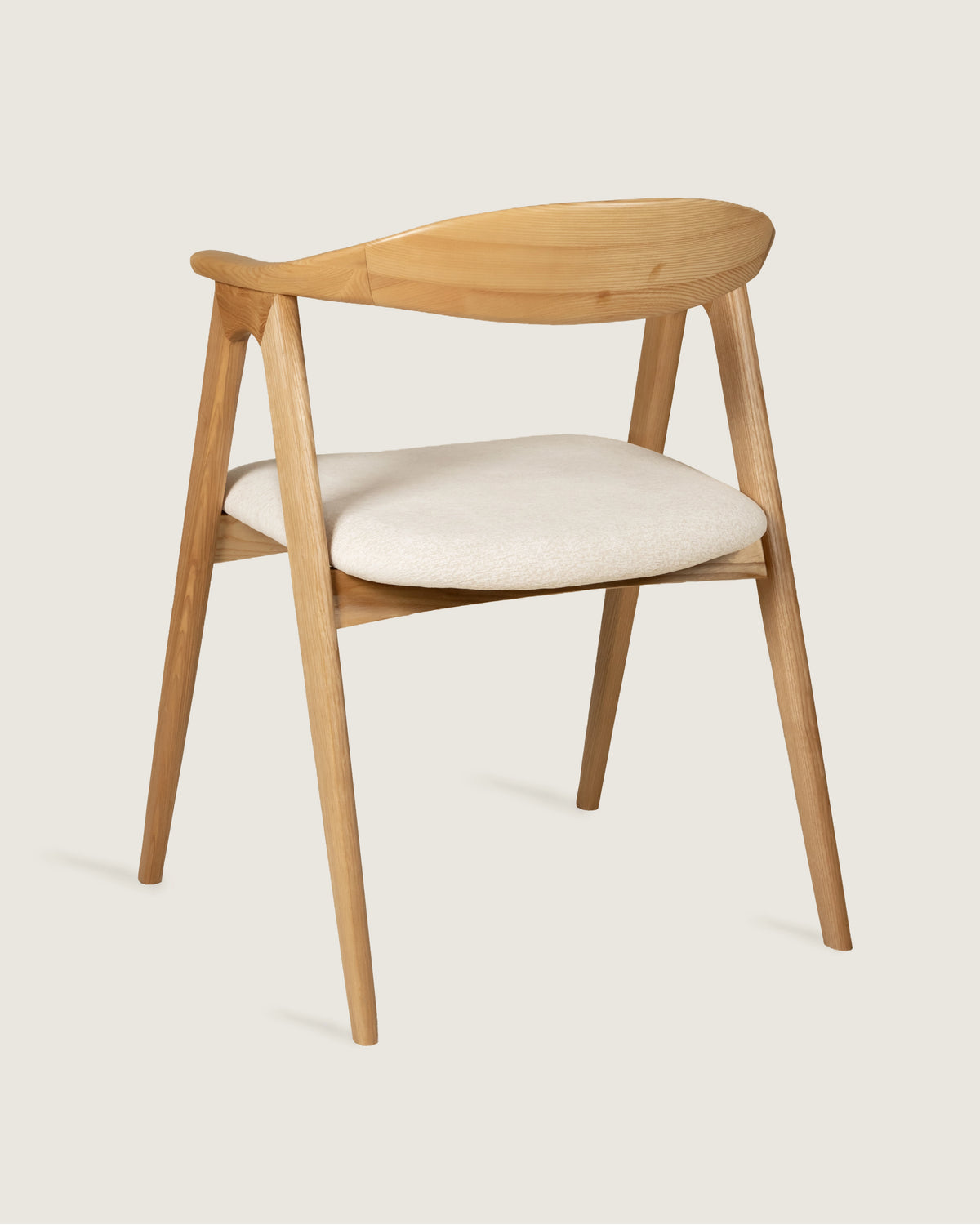 Lyra chair in different wood finishes with eos cream upholstery