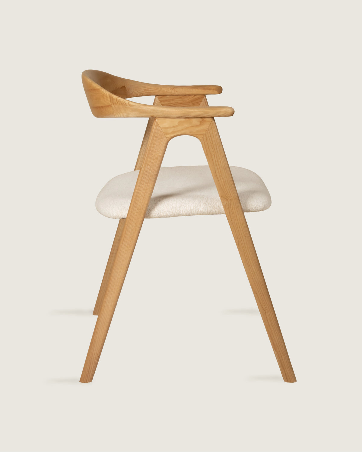 Lyra chair in different wood finishes with eos cream upholstery