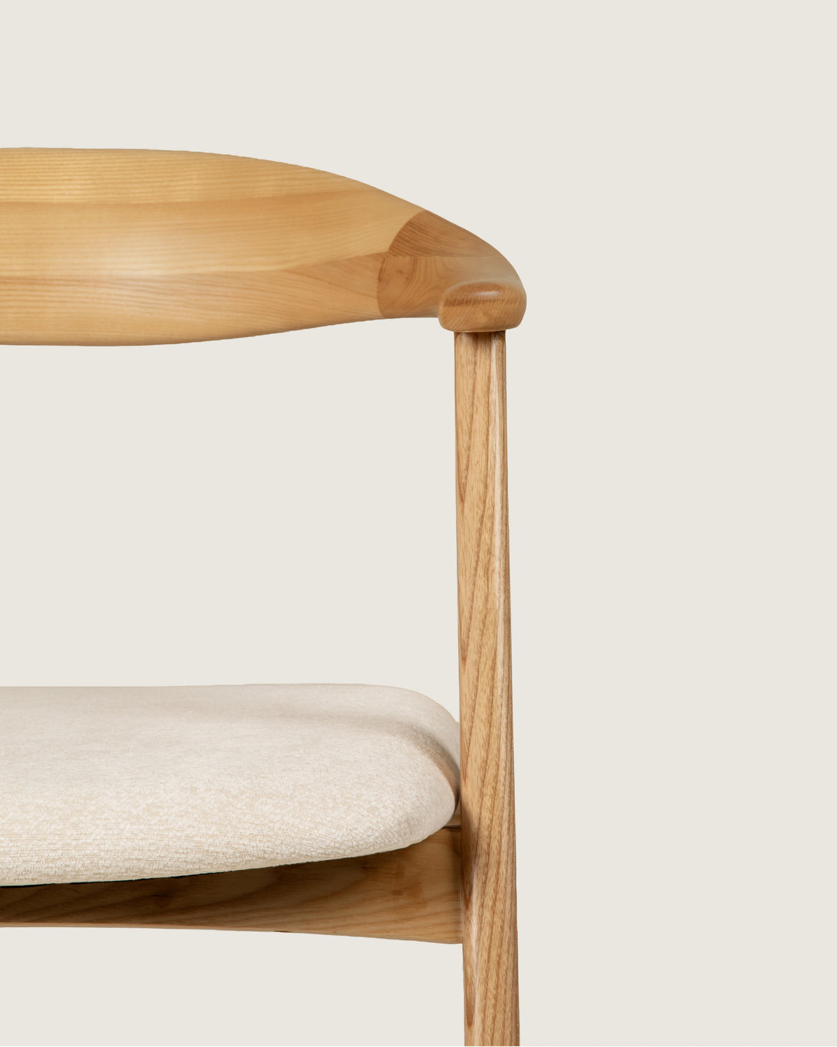 Lyra chair in different wood finishes with eos cream upholstery
