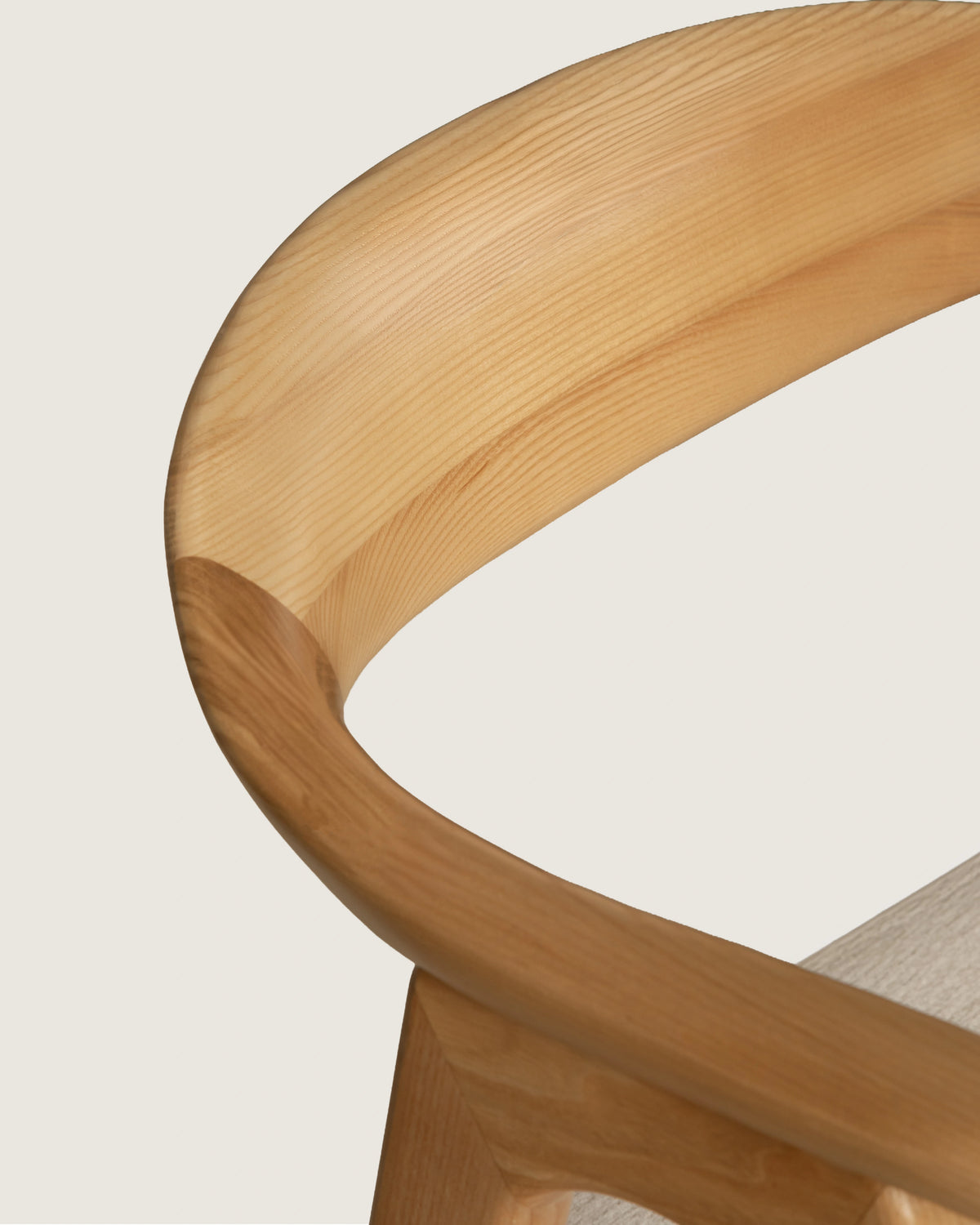 Lyra chair in different wood finishes with eos cream upholstery
