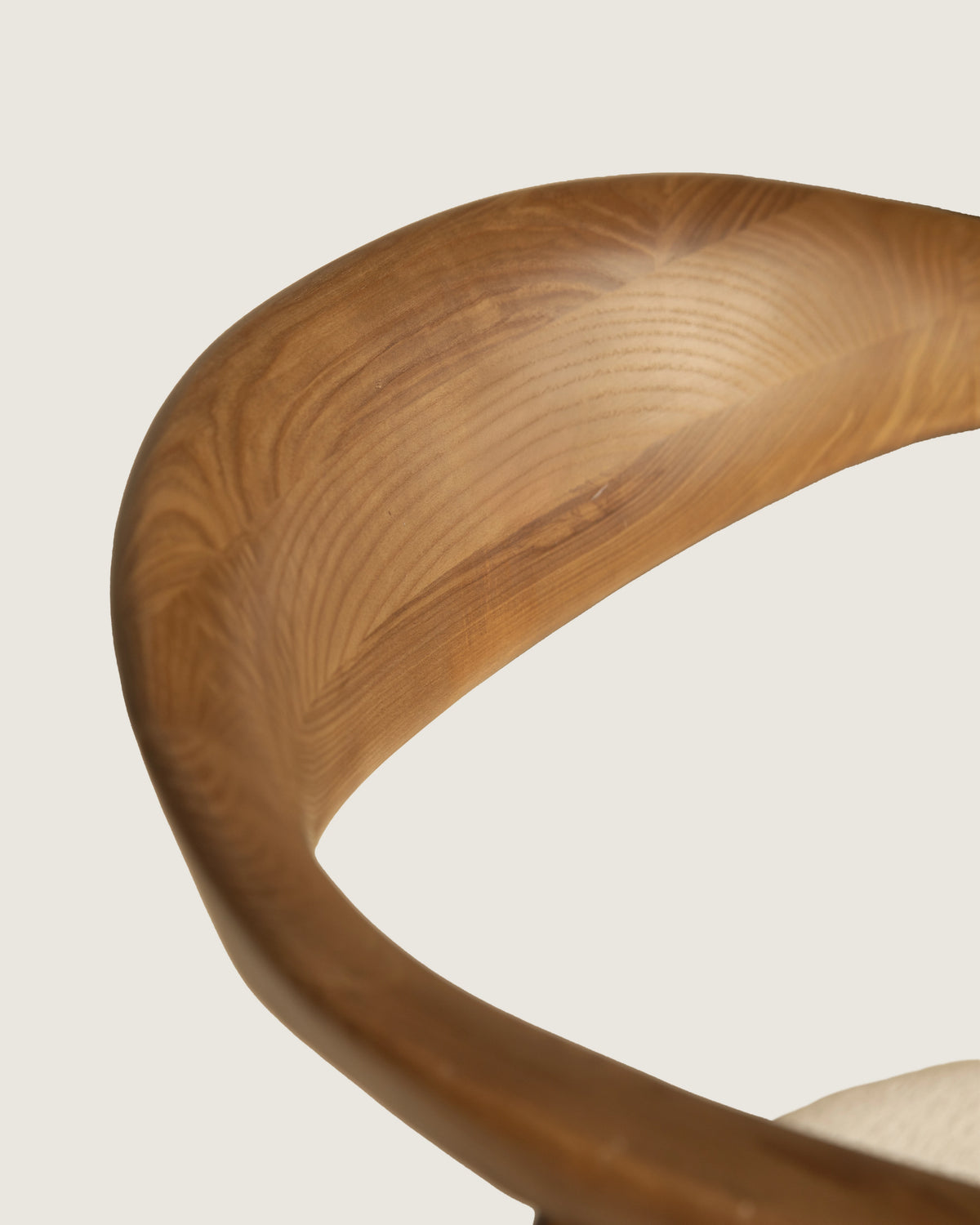 Lyra chair in different wood finishes with eos cream upholstery