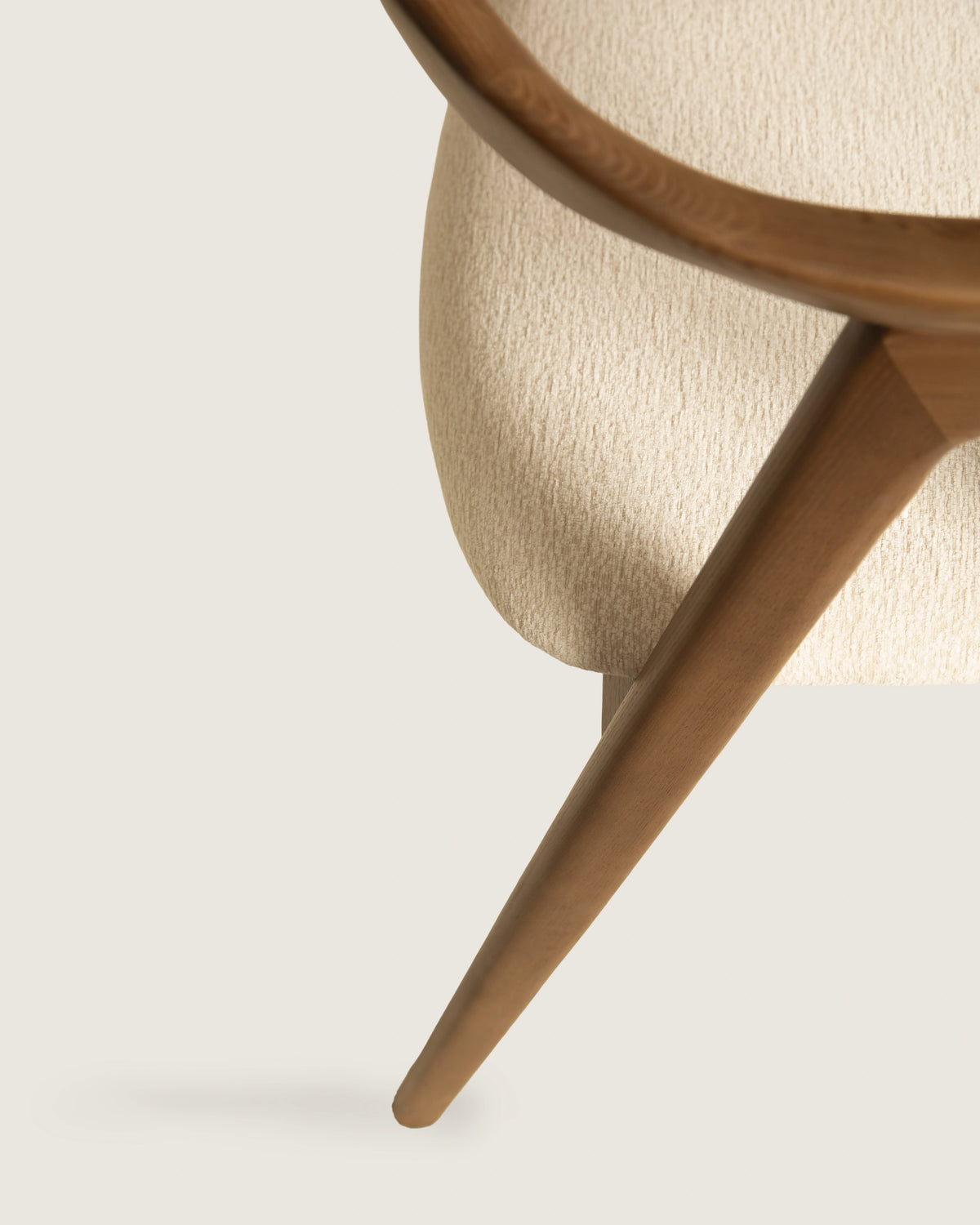 Lyra chair in different wood finishes with eos cream upholstery