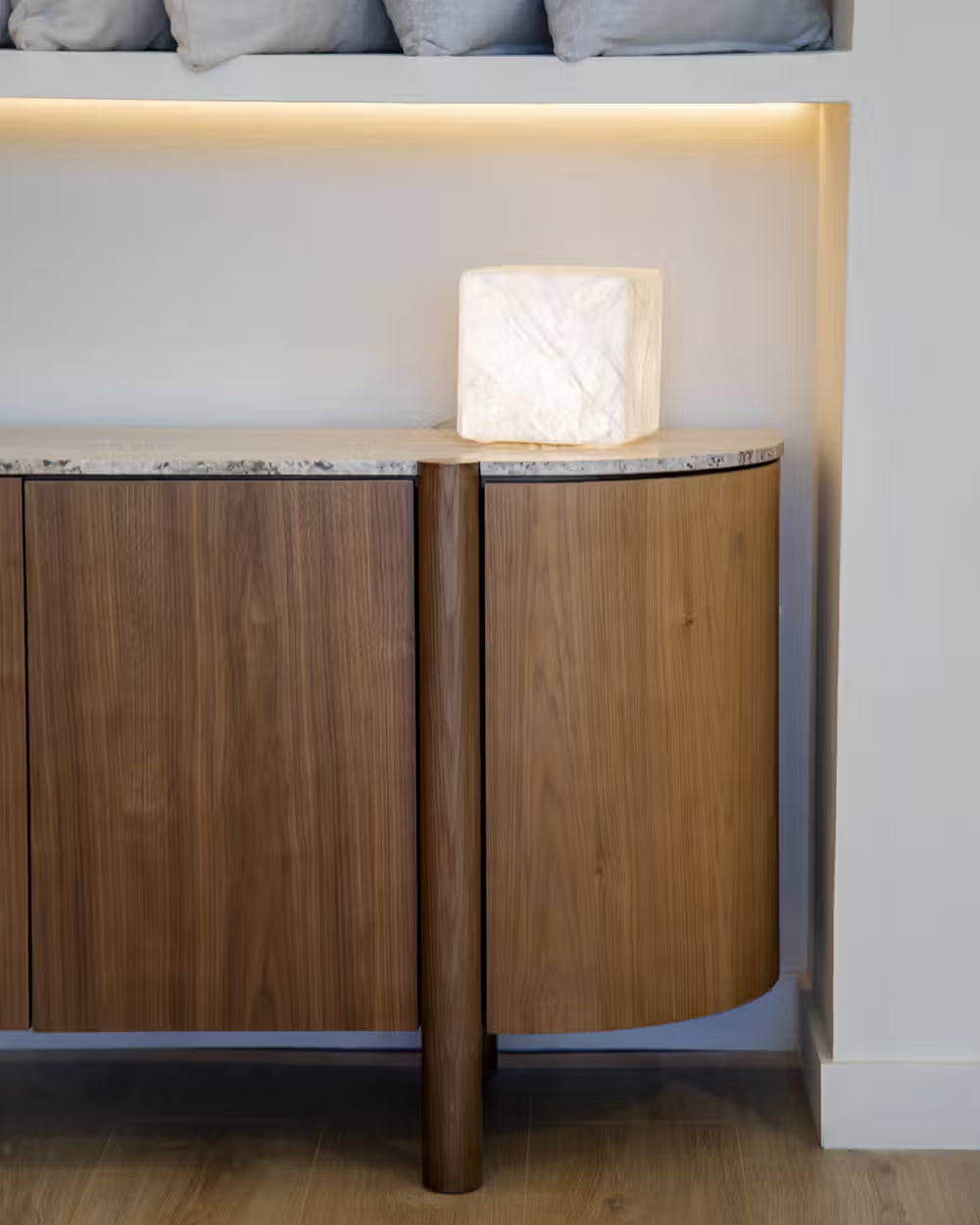 Lily  sideboard in different wood finishes with a travertine marble top