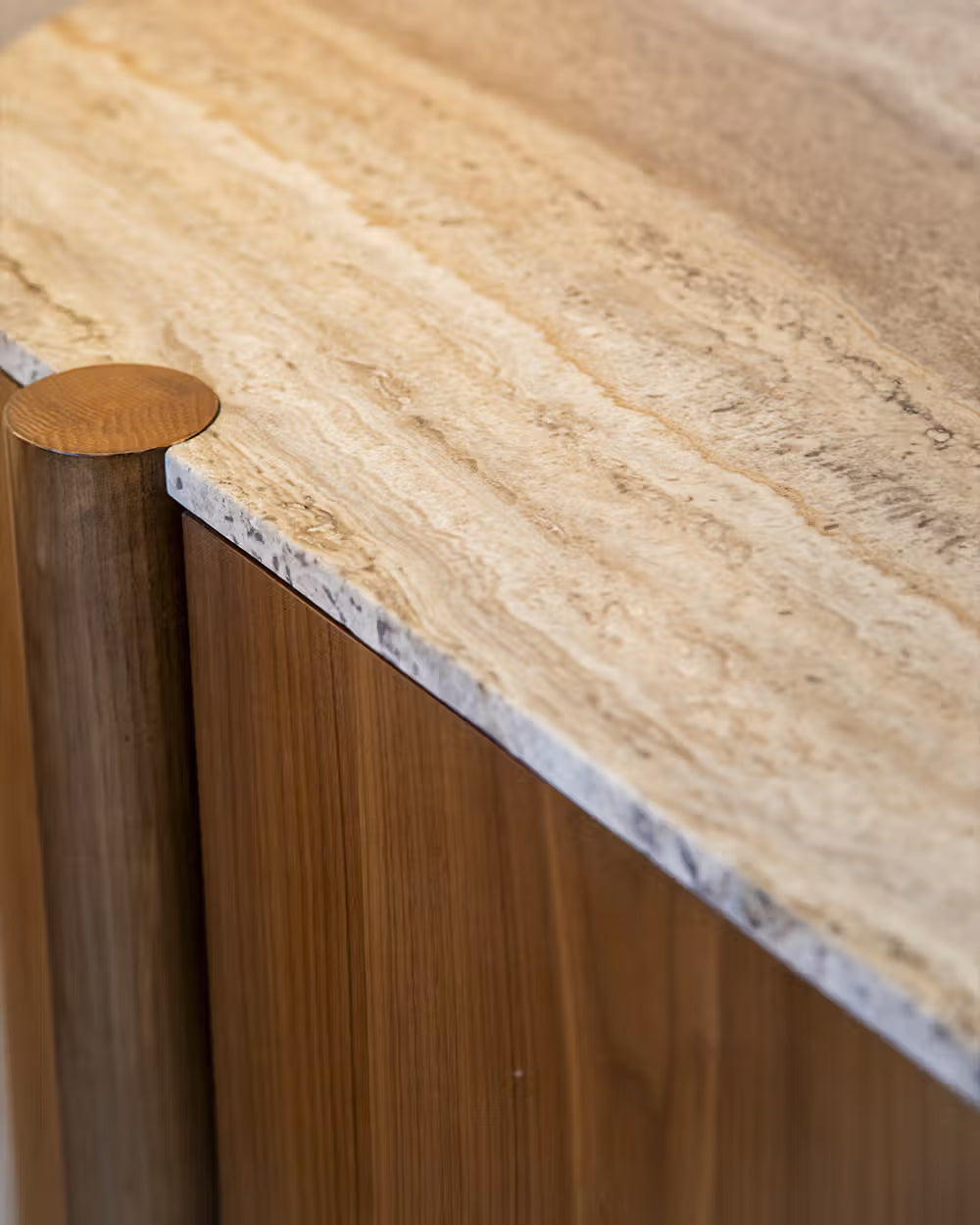 Lily  sideboard in different wood finishes with a travertine marble top