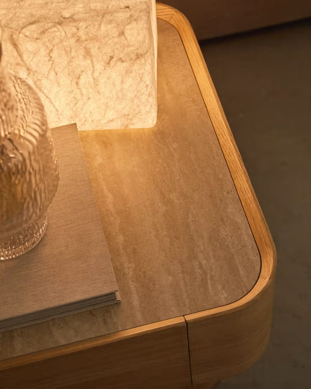 Avril side table in different wood finishes with a travertine marble top